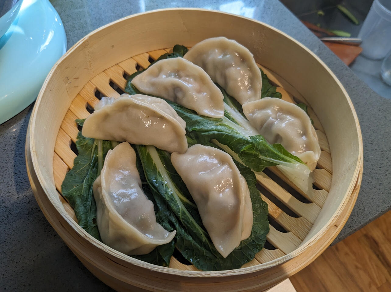 Homemade pork dumplings in bamboo steamer